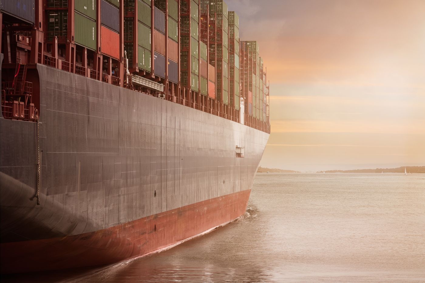 Loaded container ship underway at dusk